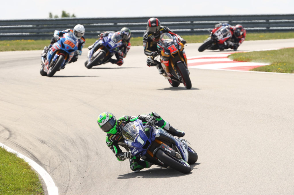 Cameron Beaubier (1) leading Mathew Scholtz (11), Bobby Fong (50), Jake Gagne (32), and Kyle Wyman (33) early in HONOS Superbike Race One. Photo by Brian J. Nelson, courtesy MotoAmerica.