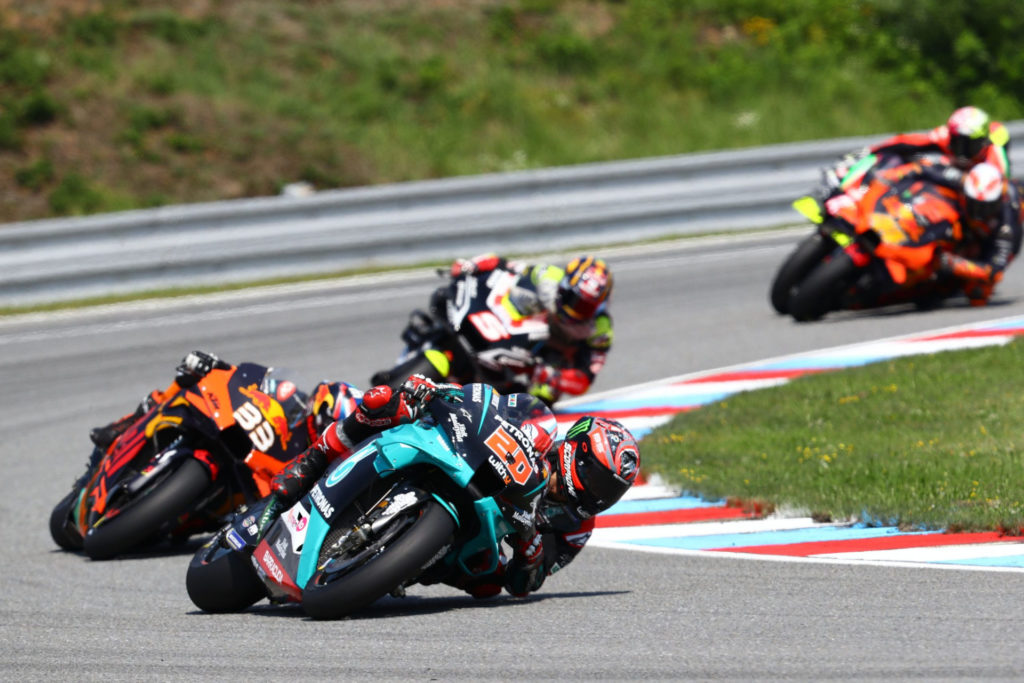 Fabio Quartararo (20) leading Brad Binder (33), Johann Zarco (5), Pol Espargaro (44), and Aleix Espargaro during the MotoGP race at Brno. Photo courtesy PETRONAS Yamaha SRT.