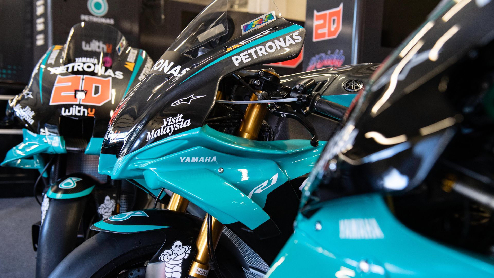 The PETRONAS replica Yamaha YZF-R1 (center) with the PETRONAS Yamaha YZR-M1 MotoGP racebikes. Photo courtesy Yamaha.