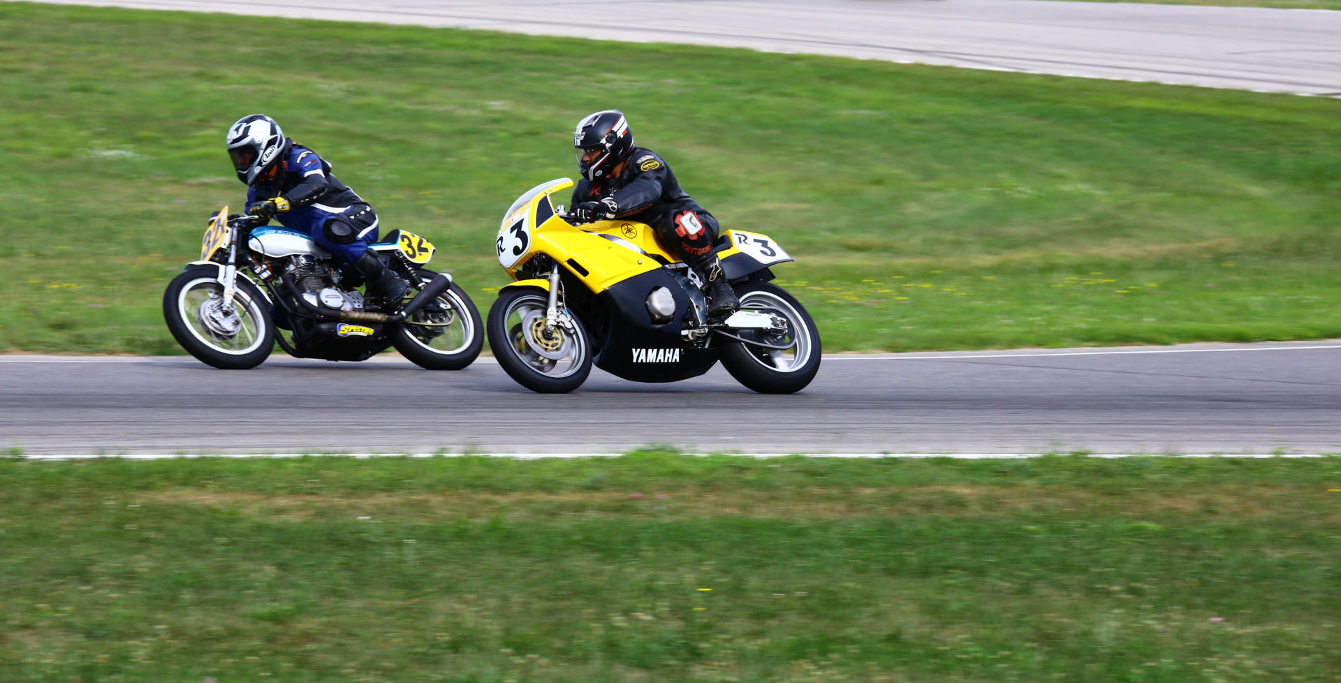 AHRMA racers David Felpel (32X) and Rick Richter (R3) in action at Gingerman Raceway. Photo by Jack Lahrman, courtesy AHRMA.