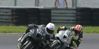 Jeremy Brinker (810) and Jeff Schoff (950) fight for the lead in the Motogladiator Superbike 1000cc race at NJMP. Photo by The SB Image, courtesy of Motogladiator.