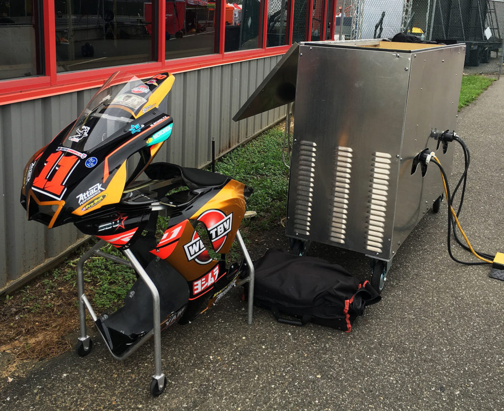 Seen On Pit Lane: Westby Racing's generators are encased in a ventilated stainless steel cart, and a set of spare bodywork has its own lightweight, wheeled cart. Photo by John Ulrich.