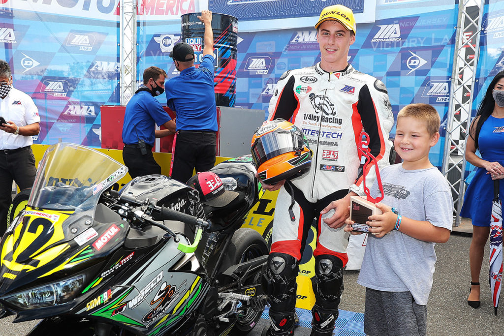 Ben Gloddy (72) at the podium, letting his brother Kyle hold his third-place trophy from Junior Cup Race Two at New Jersey Motorsports Park. Photo by Brian J. Nelson.