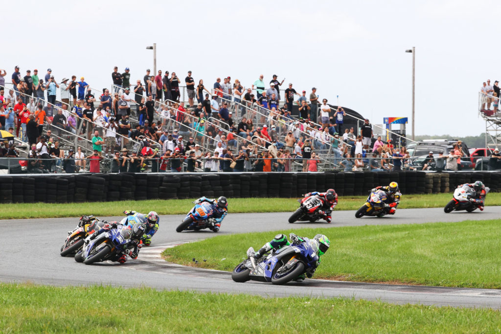 The unstoppable Cameron Beaubier (1) jumps out front of Sunday's MotoAmerica Superbike race at New JErsey Motorsports Park, chased by Jake Gagne (32), Mathew Scholtz (11), Bobby Fong (50), Kyle Wyman (33), Cam Petersen (45), and Josh Herrin (2). Photo by Brian J. Nelson.