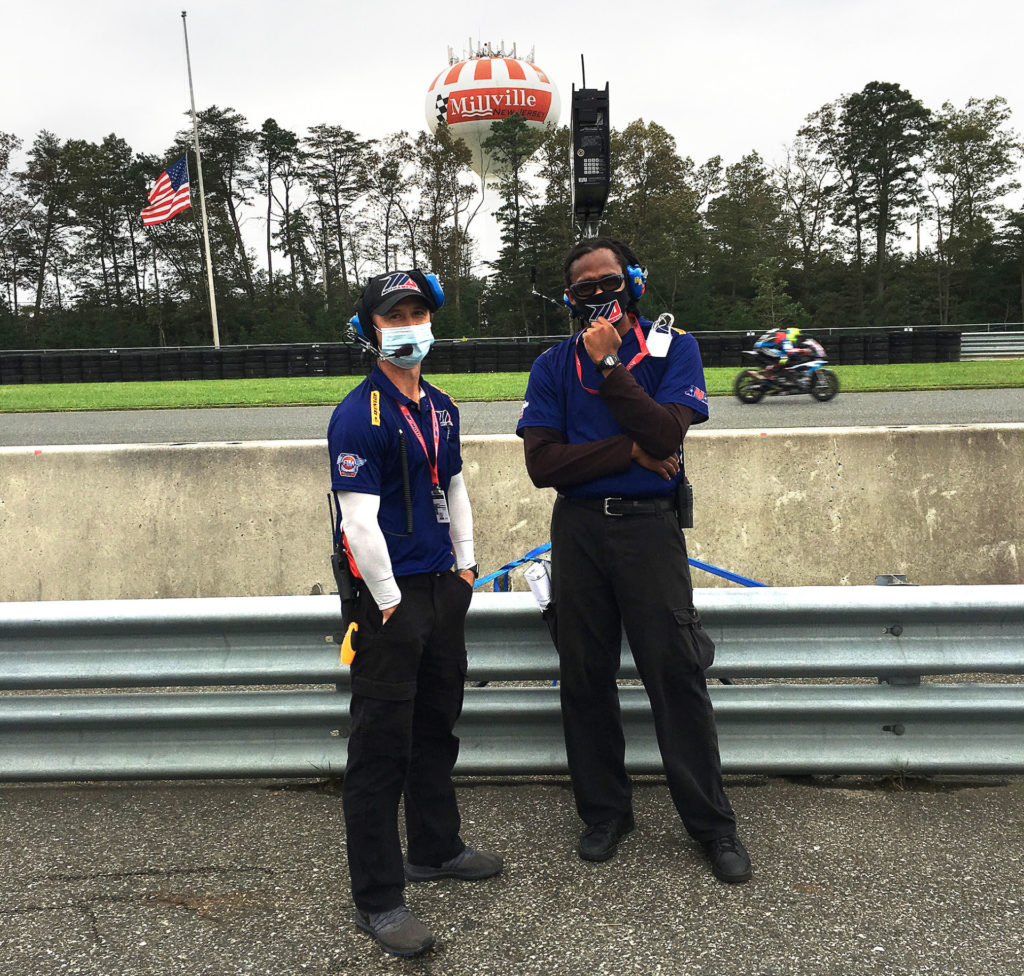 MotoAmerica officials Matt Kellerman (left) and Jonathan Matthews (right) working on pit lane. Photo by John Ulrich.