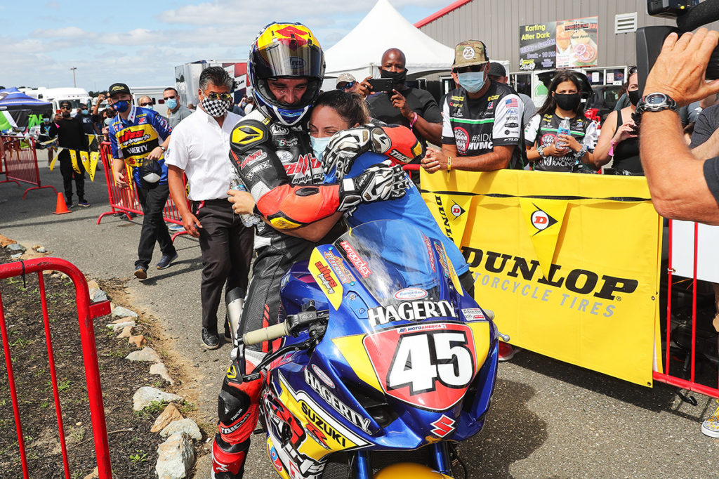 Crew Chief Melissa Paris and rider Cam Petersen hug after he won the Stock 1000 race at NJMP. Photo by Brian J. Nelson.