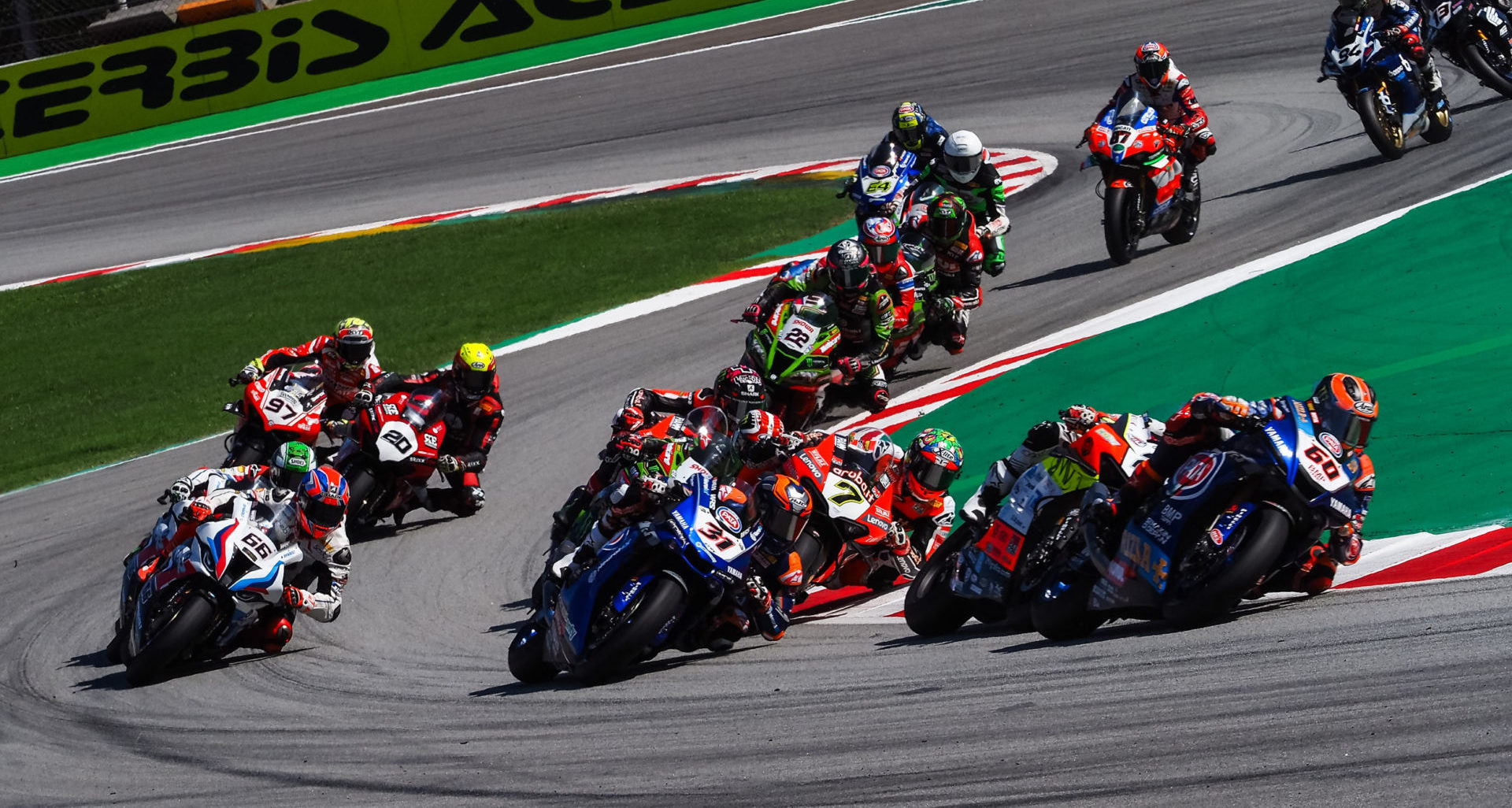 The start of World Superbike Race Two at Catalunya with Michael van der Mark (60) leading Michael Rinaldi, Garrett Gerloff (31), Chaz Davies (7), Jonathan Rea, Scott Redding, and the rest of the field. Photo courtesy Dorna.