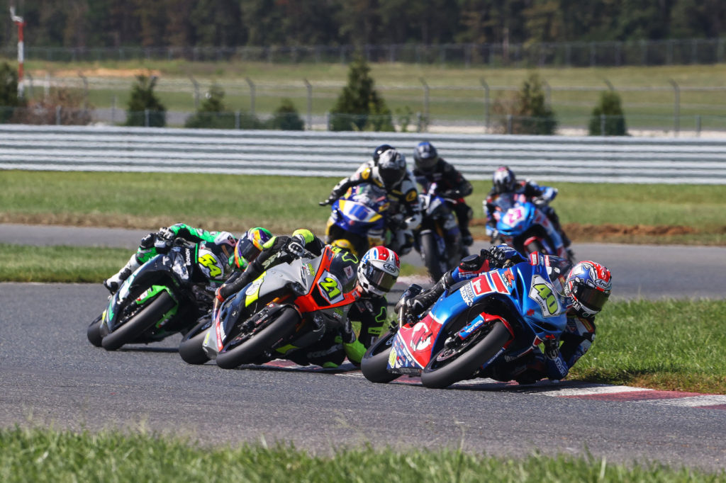 Sean Dylan Kelly (40) leads Brandon Paasch (21), Richie Escalante (54), Kevin Olmedo (16), Xavier Zayat, Benjamin Smith, and Lucas Silva (23) in the Saturday Supersport race; points lead Escalante won. Photo by Brian J. Nelson.