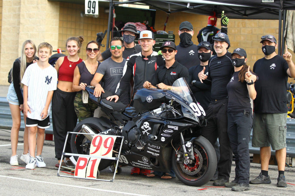 Army Of Darkness Race Bike “Yankii” surrounded by team members (from left): Lane Peris, Jake Peris, Ella Peris, Jen Peris, Chris Peris, Tim Gooding, Andrew Lee, Ben Walters, Chris Manfrin, YT Lechner, Sam Fleming, Melissa Berkoff, and Anthony Consorte. Photo by Photos by Marty, LLC, courtesy Army of Darkness.