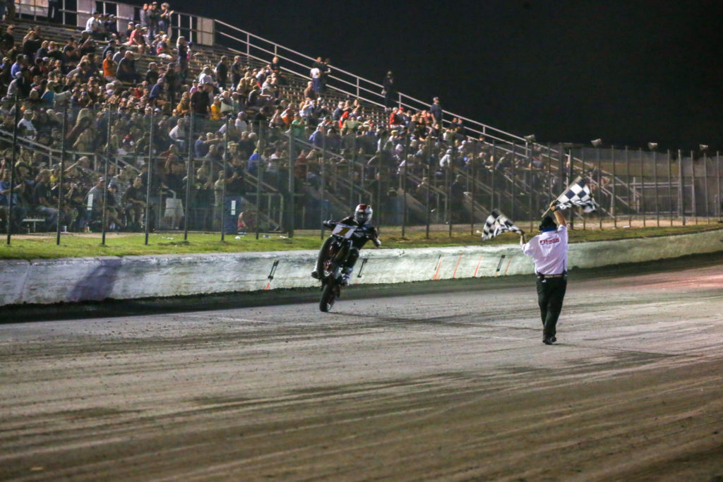 Briar Bauman (1) takes the checkered flag at Dallas Half-Mile II. Photo by Scott Hunter, courtesy AFT.