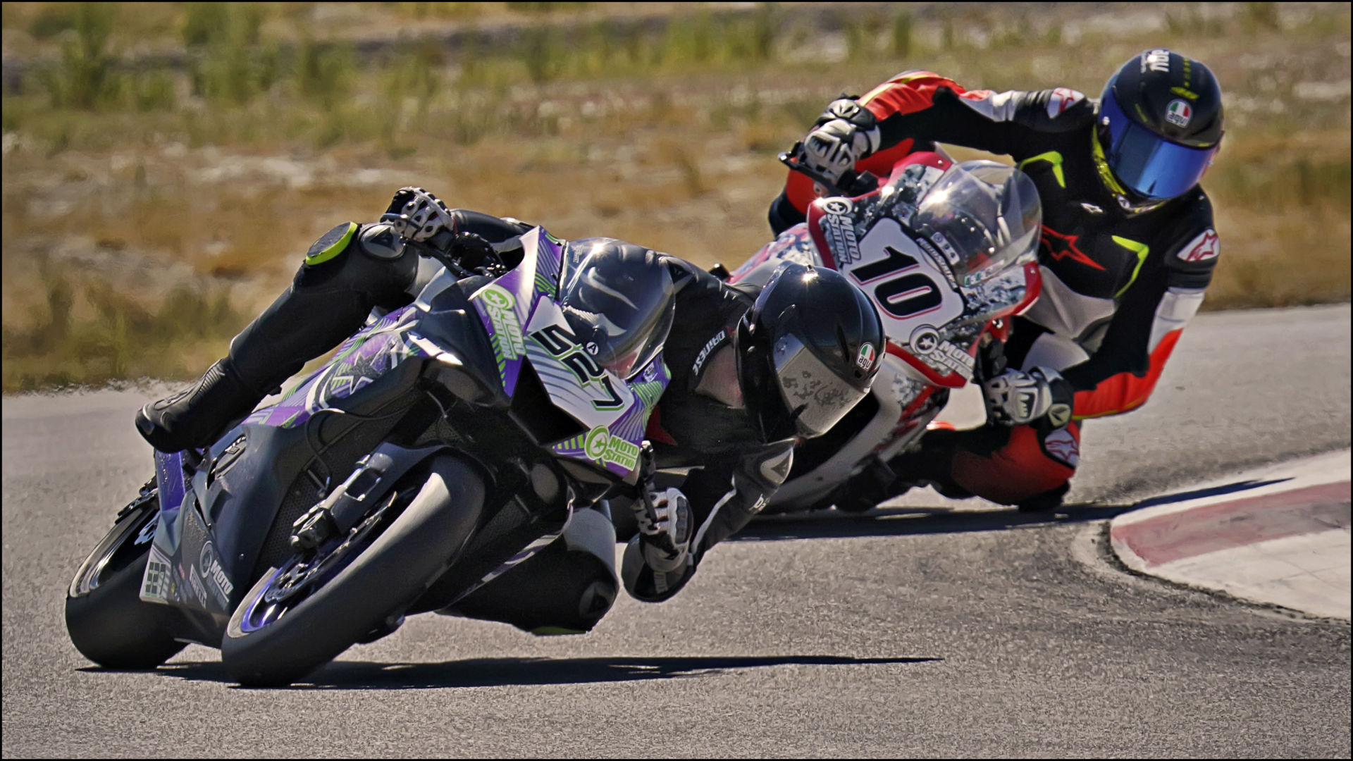 Jerry Hicks (527) holds off Eric Jones (10) during the UtahSBA King of the Mountain GTO finale at Utah Motorsports Campus. Photo by Steve Midgley, courtesy UtahSBA.