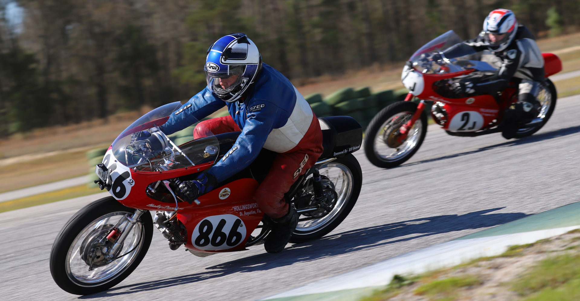 AHRMA racers Jonathan Hollingsworth (2J) and Dick Hollingsworth (866) in action. Photo by etechphoto.com, courtesy AHRMA.