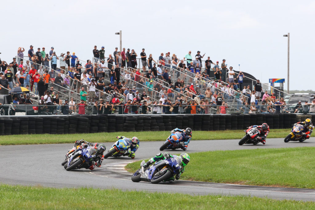 Cameron Beaubier (1) leads Jake Gagne (32), Mathew Scholtz (11), Toni Elias (24), Bobby Fong (50), Kyle Wyman (33), and Cameron Petersen early in MotoAmerica Superbike Race Two in New Jersey. Photo by Brian J. Nelson, courtesy MotoAmerica.