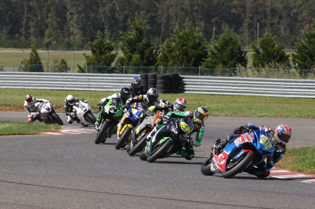 Sean Dylan Kelly (40) leads Richie Escalante (54), Brandon Paasch (21), Kevin Olmedo (16), Xavier Zayat (24) and the rest of the field at the start of Supersport Race One. Photo by Brian J. Nelson, courtesy MotoAmerica.