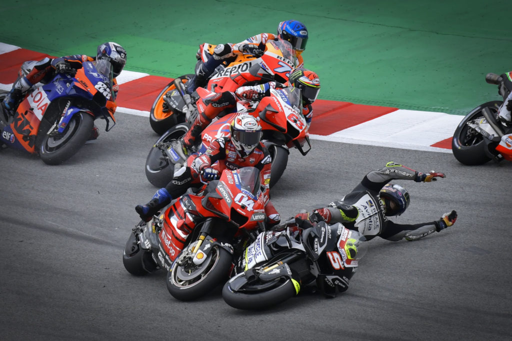 Andrea Dovizioso (04) was taken out by Johann Zarco (5) in a chain-reaction crash on the first lap. Photo courtesy Dorna.