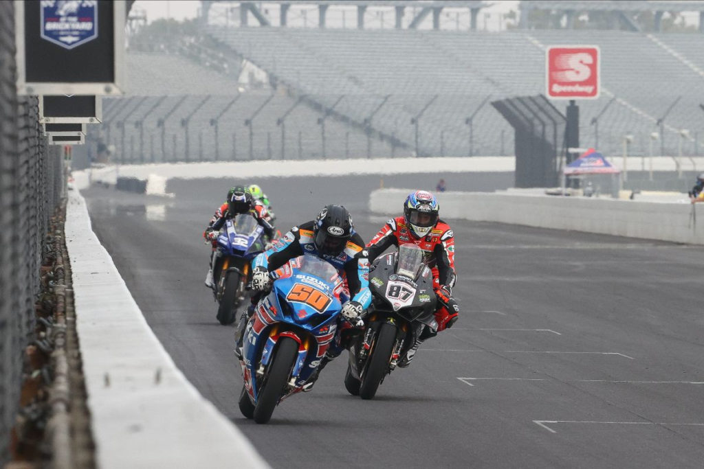 Bobby Fong (50) leads Lorenzo Zanetti (87), Jake Gagne (32), and Cameron Beaubier down the front straightaway at Indianapolis Motor Speedway. Photo by Brian J. Nelson, courtesy MotoAmerica.