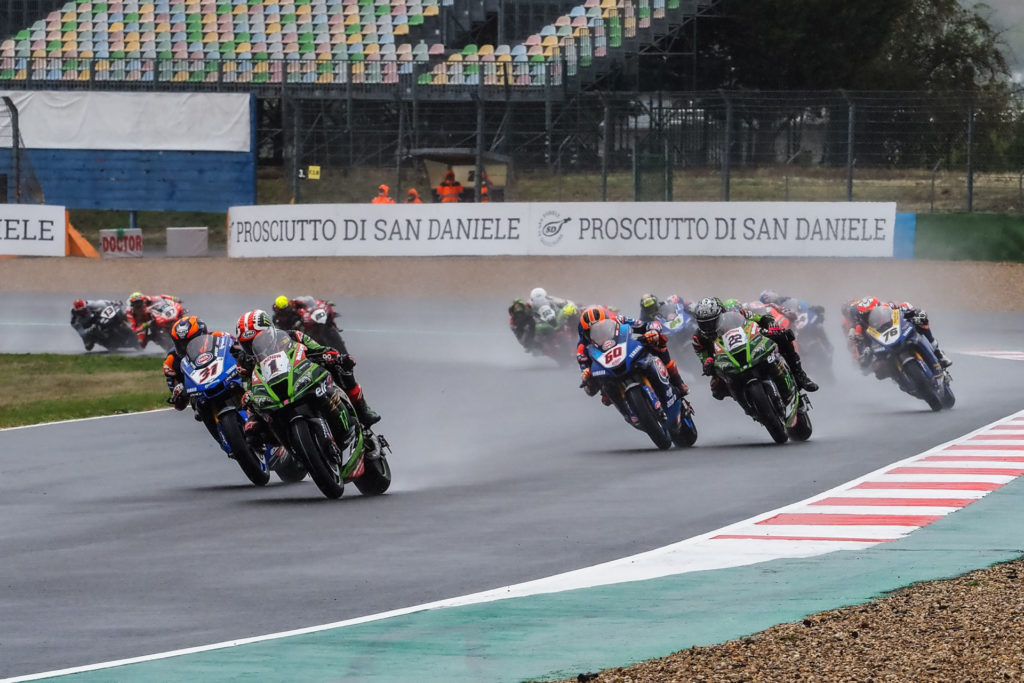 Jonathan Rea (1) leads Garrett Gerloff (31), Michael van der Mark (60), Alex Lowes (22), Loris Baz (76) and the rest of the field at the start of Race One. Photo courtesy Dorna WorldSBK Press Office.