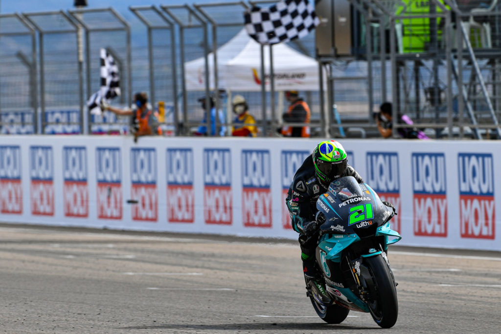 Franco Morbidelli (21) taking the checkered flag at Motorland Aragon II. Photo courtesy Dorna.