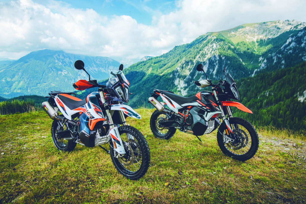 A 2021 KTM 890 Adventure R Rally edition (left) and a 2021 KTM 890 Adventure R (right) at rest. Photo by Sebas Romero, courtesy KTM.