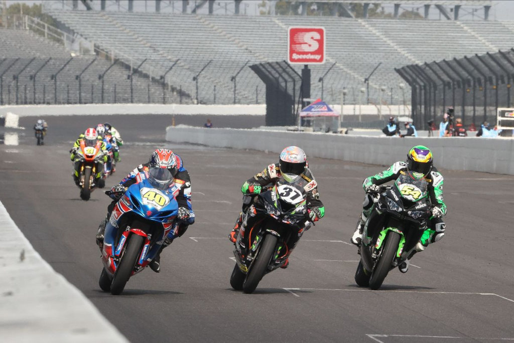 Sean Dylan Kelly (40), Stefano Mesa (37), and Richie Escalante (54) battle for the lead in MotoAmerica Supersport Race Two at Indianapolis Motor Speedway. Photo by Brian J. Nelson, courtesy MotoAmerica.