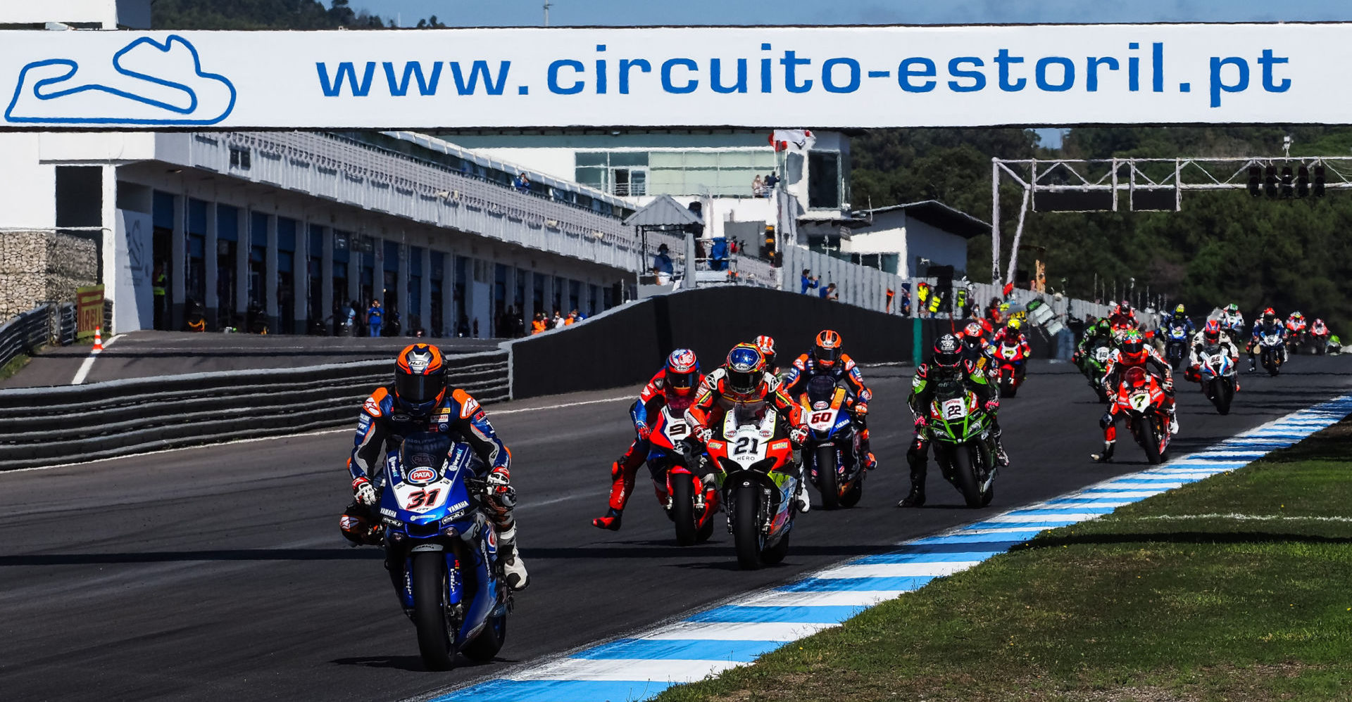 Garrett Gerloff (31) leading a group of riders into Turn One at Estoril. Photo courtesy Dorna.