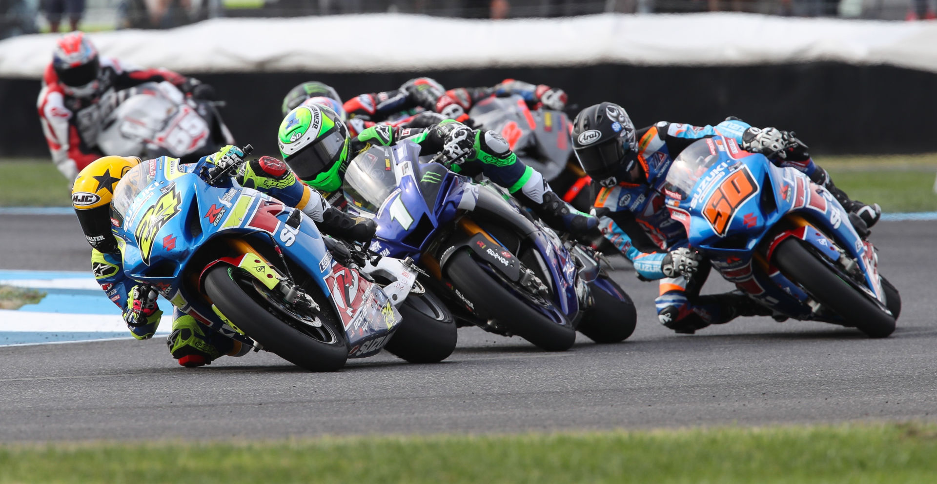 Toni Elias (24), Cameron Beaubier (1), and Bobby Fong (50) lead the start of MotoAmerica Superbike Race One at Indianapolis Motor Speedway. Photo by Brian J. Nelson.