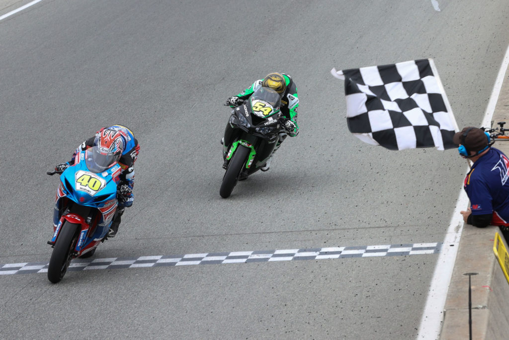 Sean Dylan Kelly (40) used a last-lap pass to defeat Richie Escalante (54) by a fraction of a second in MotoAmerica Supersport Race Two Sunday at Laguna Seca. Photo by Brian J. Nelson, courtesy MotoAmerica.