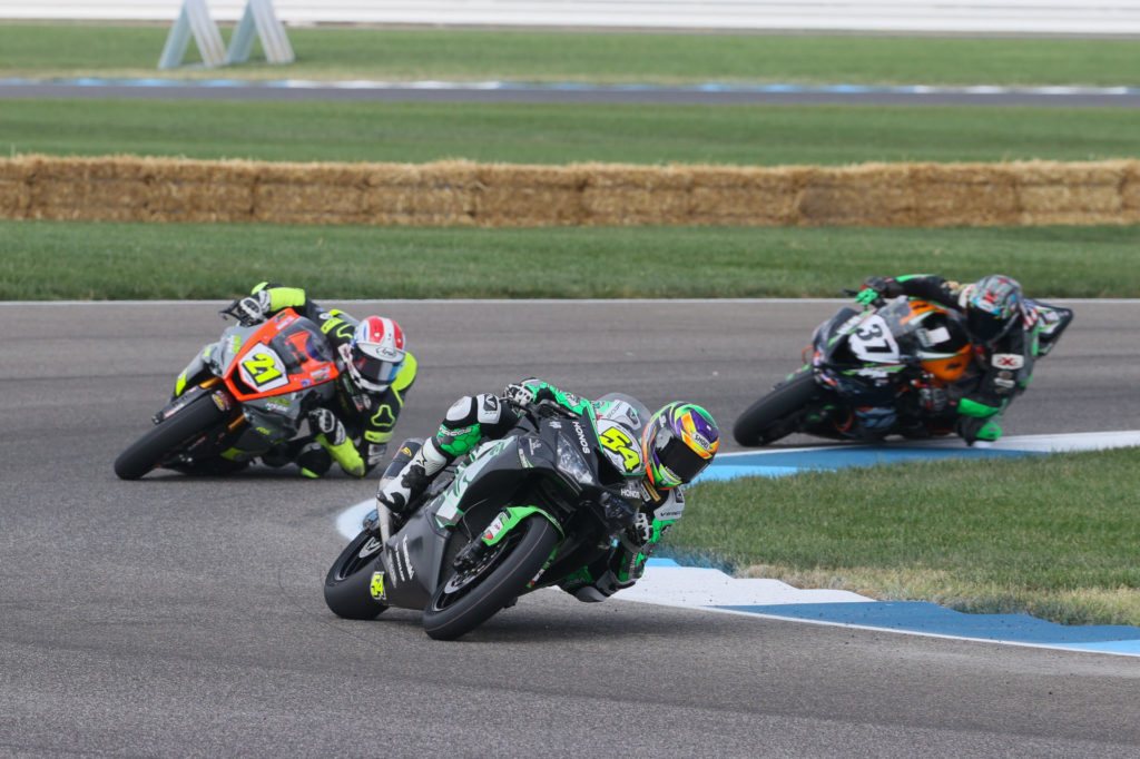 Brandon Paasch (21) and Stefano Mesa (37) chase leader Richie Escalante (54) early in Supersport Race One. Photo by Brian J. Nelson.