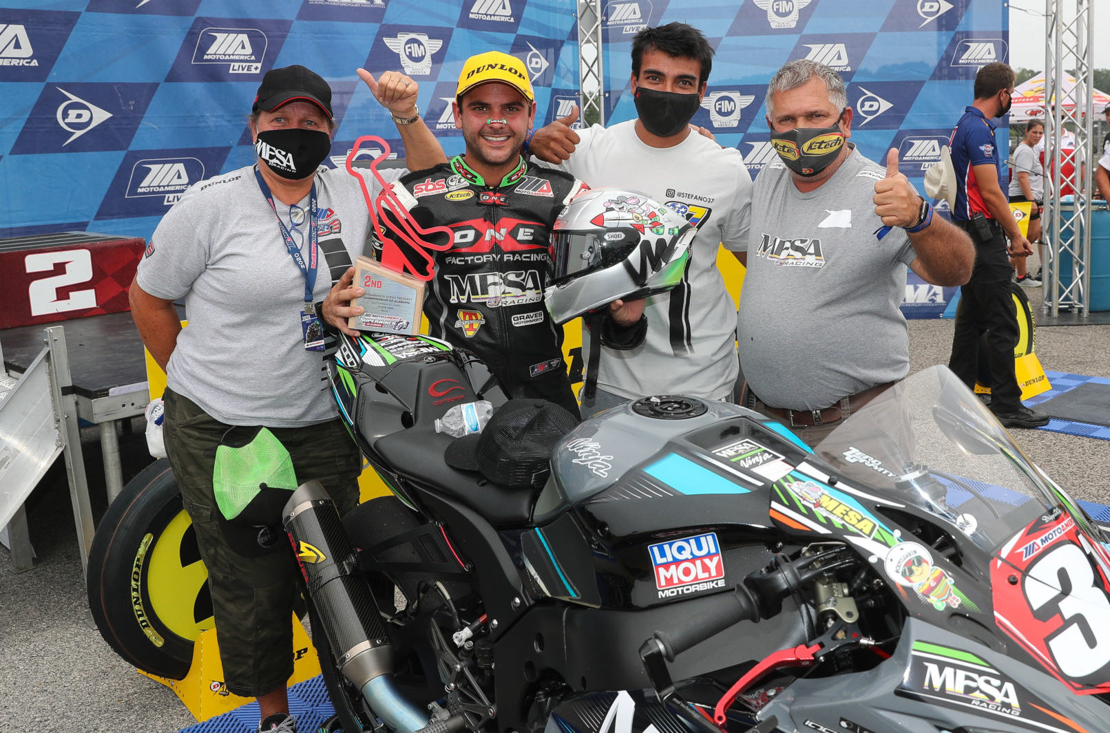 Stefano Mesa (second from left) with his father Mauricio (far right), his mother Karen (far left) and friend/crew member Erick Orozco (second from right) at the MotoAmerica Stock 1000 podium at Barber Motorsports Park. Photo by Brian J. Nelson.