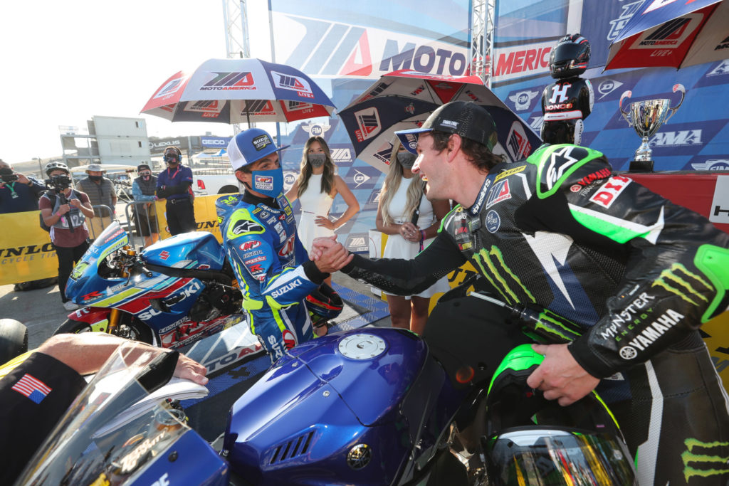 Toni Elias (left) and Cameron Beaubier (right) congratulate each other after MotoAmerica Superbike Race One at Laguna Seca. Beaubier won, and Elias finished second. Photo by Brian J. Nelson.