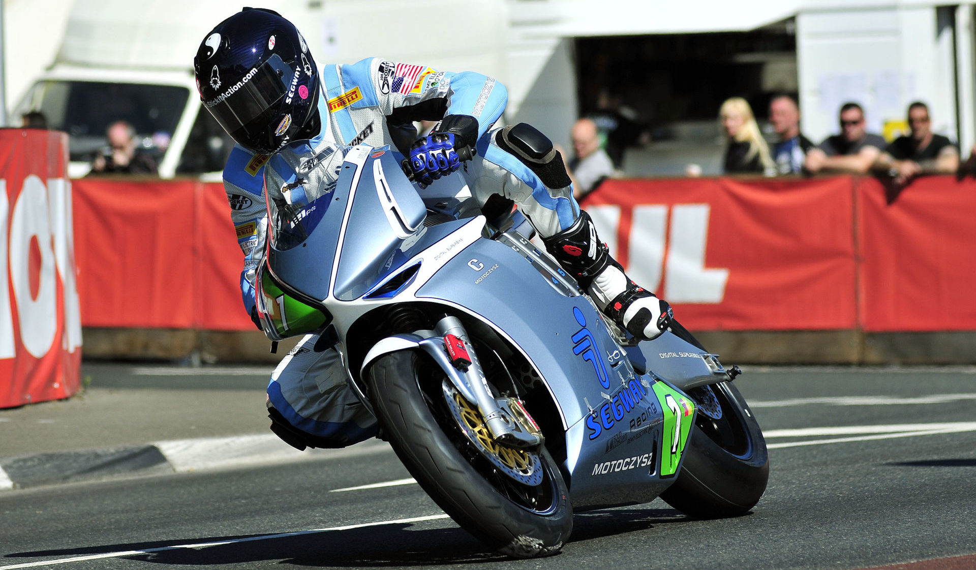 Mark Miller (1) on the MotoCzysz electric racebike at the Isle of Man TT in 2011. Photo courtesy of IOM TT Press Office.