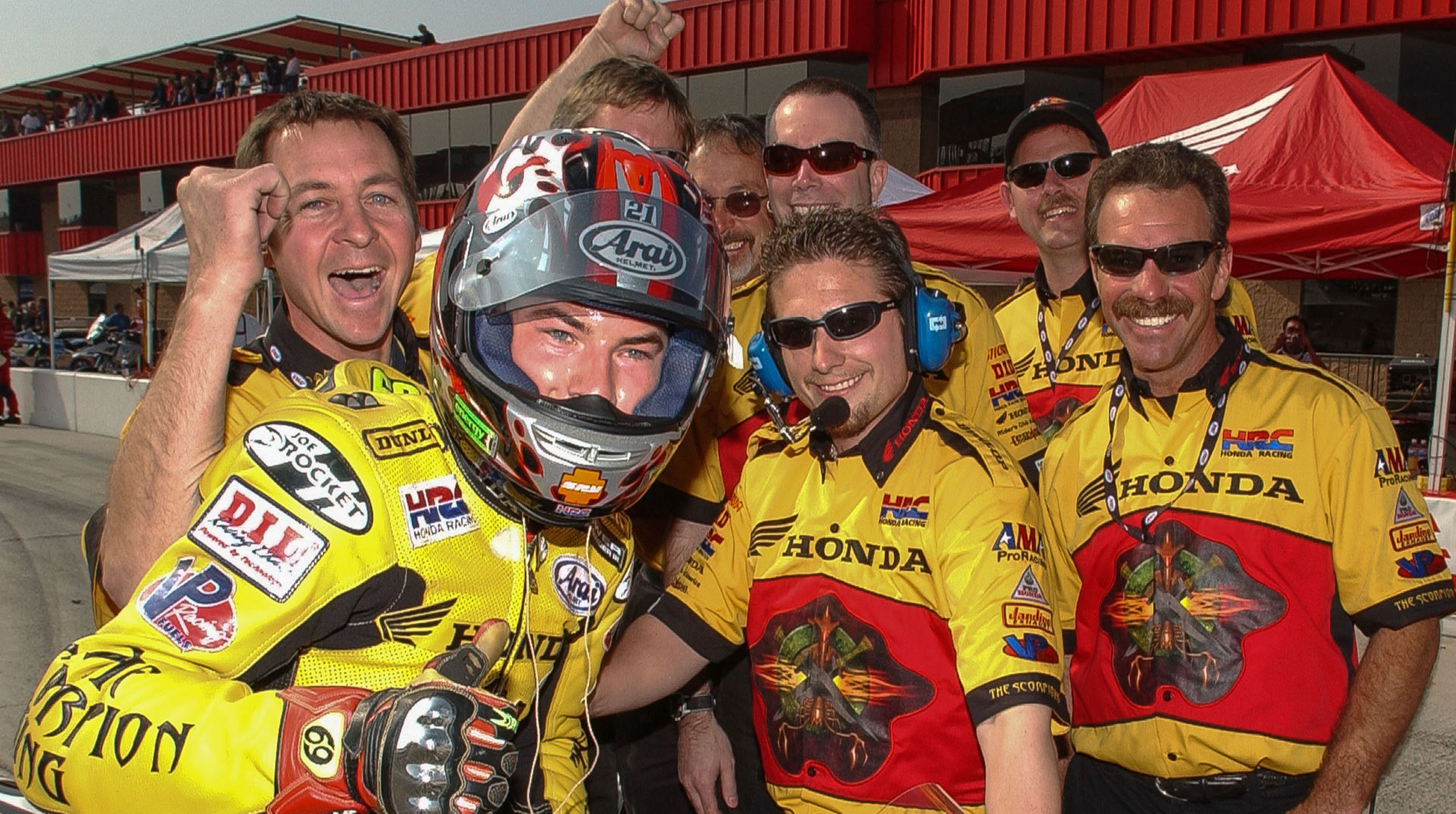 Chuck Miller (far right) with the late Nicky Hayden and his crew after winning an AMA Pro Superbike race at Auto Club Speedway in 2002. Pictured from left is: Mark Braunwalder, Dan Fahie (behind Hayden), the late Merlyn Plumlee, Davey Jones, Darin Marshall, and Ray Plumb. Photo by Brian J. Nelson.