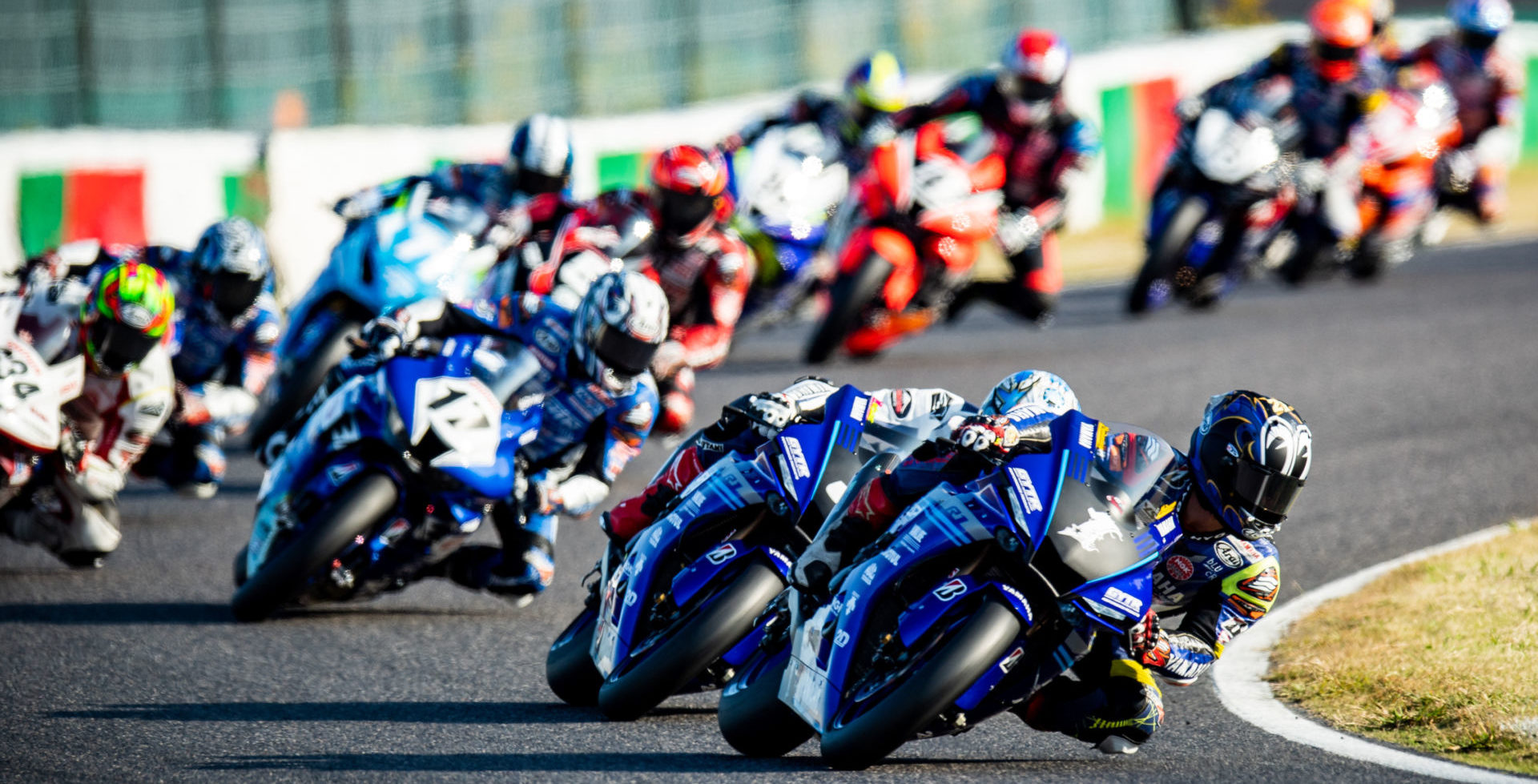 Katsuyuki Nakasuga (1) leads Kohta Nozane (3) and the rest of the field during the start of MFJ All-Japan JSB1000 Race One at Suzuka. Photo by Kohei Hirota Photography.