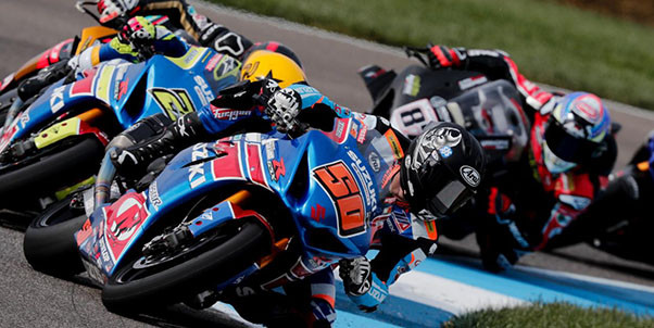 Bobby Fong (50) leads Toni Elias (24), Mathew Scholtz, and Lorenzo Zanetti (87) during one of the MotoAmerica Superbike Race One starts at Indianapolis Motor Speedway. Photo courtesy IMS Photo.