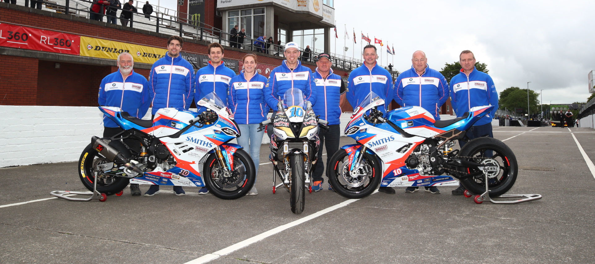 Smiths Racing team at the Isle of Man TT with rider Peter Hickman (center) flanked by Alan Smith (right) and Rebecca Smith (left). Photo courtesy Smiths Racing.