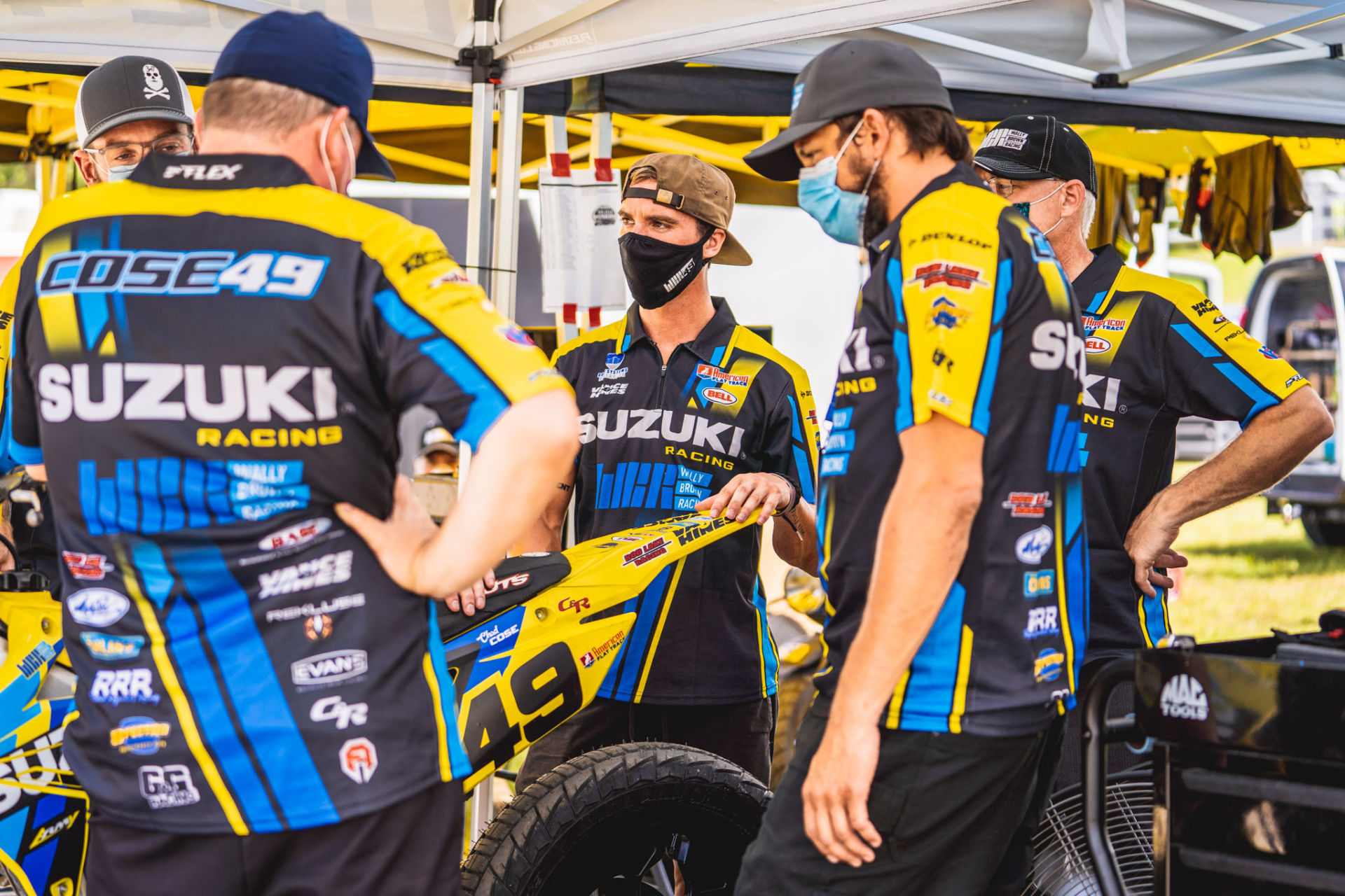 Chad Cose (center) surrounded by his Wally Brown Racing team. Photo courtesy Wally Brown Racing.