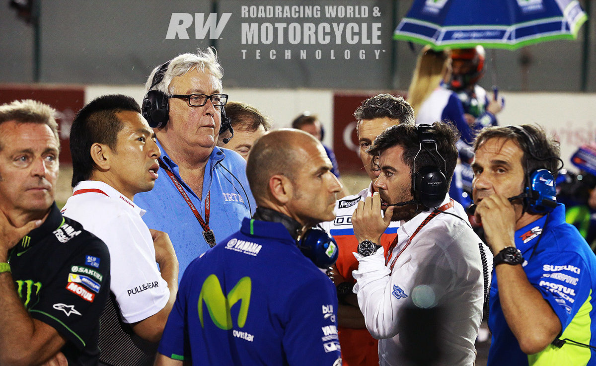 A towering presence among paddock luminaries, Mike Trimby (wearing glasses) on the MotoGP grid with (from left) Tech 3 owner Herve Poncharal, HRC Technical Director Takeo Yokoyama, factory Yamaha Team Manager Massimo Meregalli, Dorna's Carlos Ezpeleta, and Suzuki Team Manager Davide Brivio, Qatar, 2017. Mike Trimby had a lot to do with building MotoGP into the spectacle fans love. Photo by Gold & Goose.