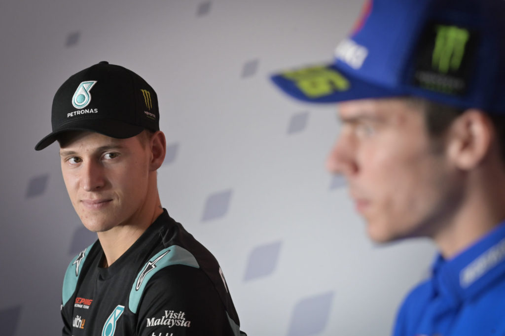 Fabio Quartararo (left) listens as Joan Mir (right) speaks at the pre-event press conference at Valencia II. Photo courtesy Dorna.