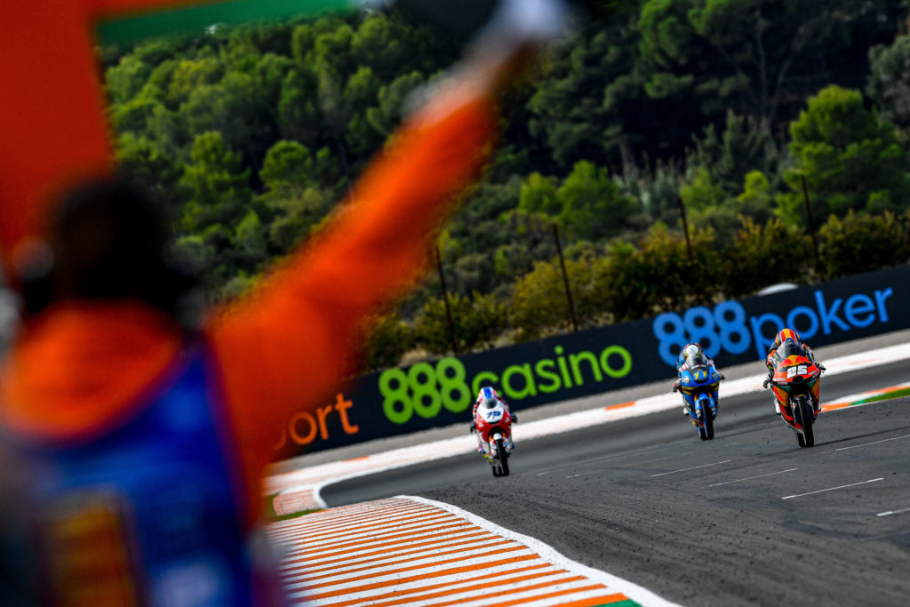 Raul Fernandez (25) leads Sergio Garcia (11) and Ai Ogura (79) to the finish line. Photo courtesy Dorna.