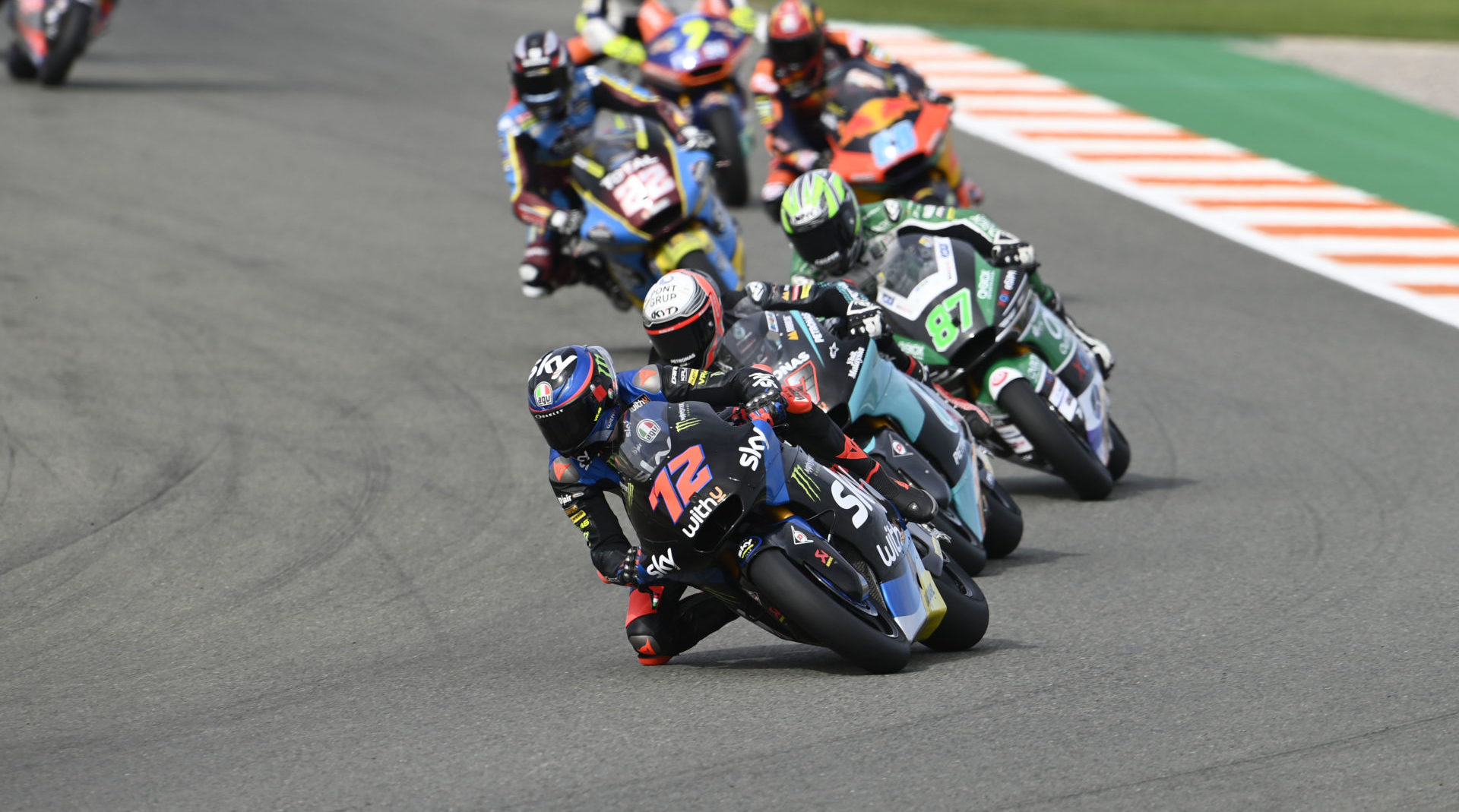 Marco Bezzecchi (72) leading the Moto2 race at Valencia #1. Photo courtesy Triumph.