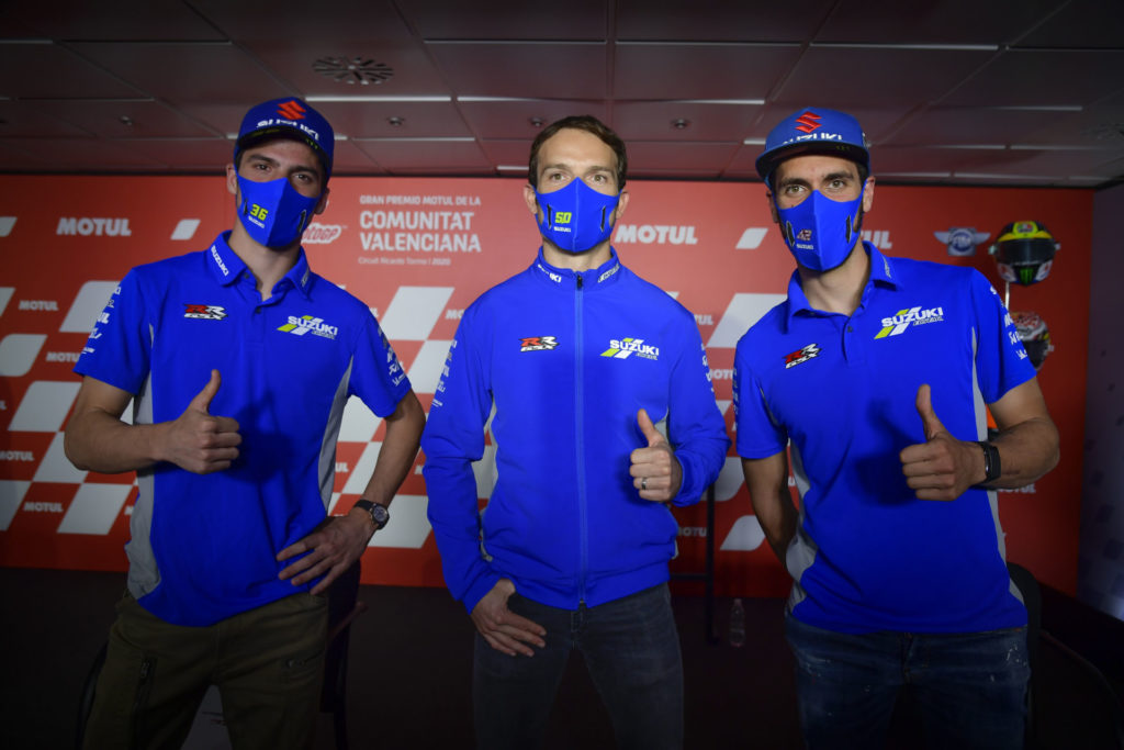 Team Suzuki ECSTAR racers Joan Mir (left) and Alex Rins (right) with test rider Sylvain Guintoli (center). Photo courtesy Dorna.