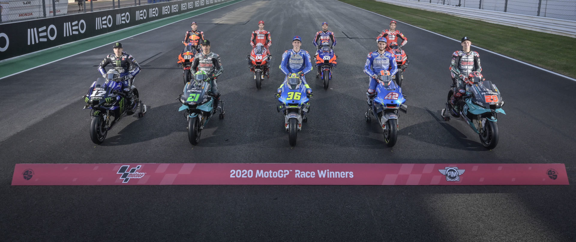 The nine different MotoGP race winners, so far, in 2020: Maverick Vinales (12), Brad Binder (33), Franco Morbidelli (21), Andrea Dovizioso (04), Joan Mir (36), Miguel Oliveira (88), Alex Rins (42), and Danilo Petrucci (9). Photo courtesy Dorna.