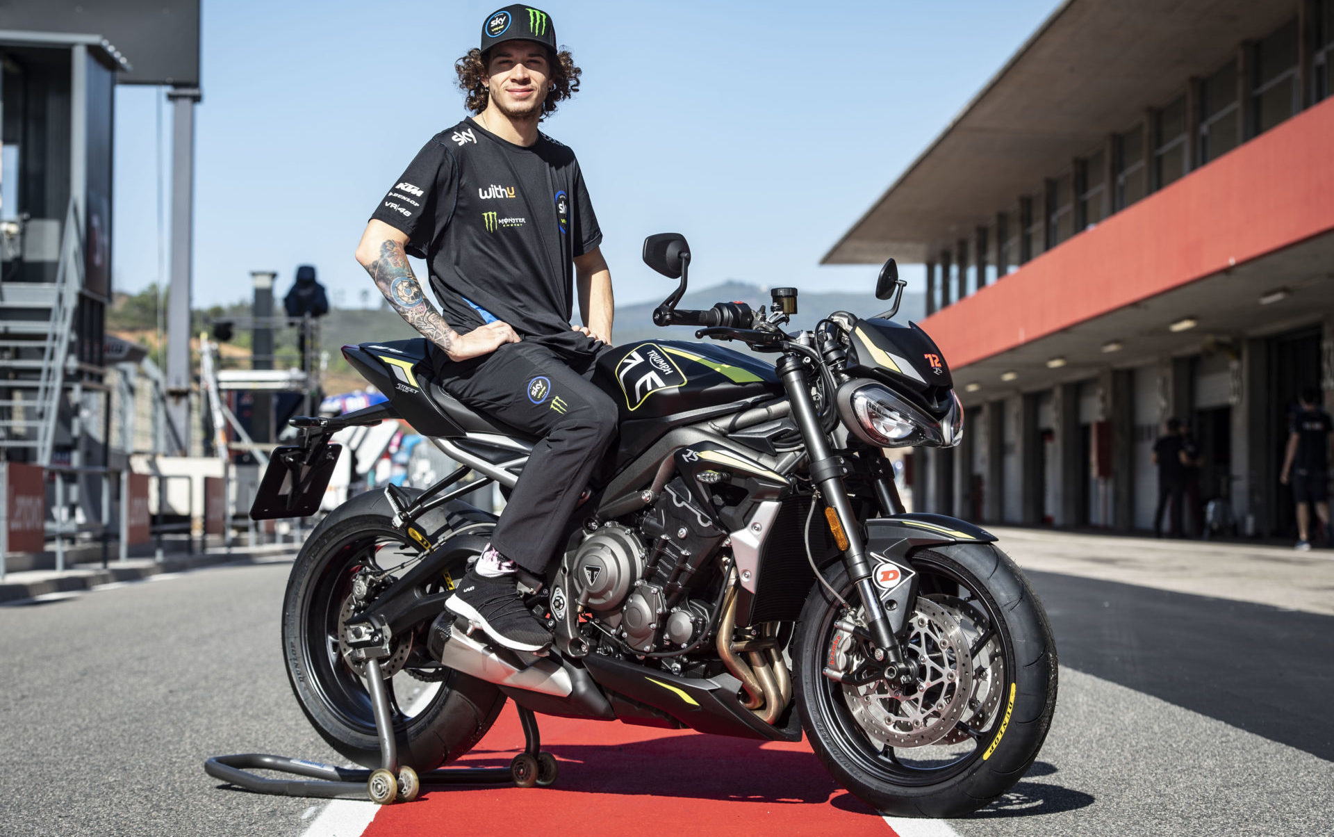 Marco Bezzecchi and the Triumph Street Triple RS that he earned for winning the Triumph Triple Trophy contest. Photo courtesy Triumph.