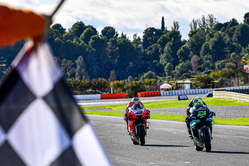 Franco Morbidelli (21) beats Jack Miller (43) to the checkered flag to win at Valencia II. Photo courtesy Dorna.