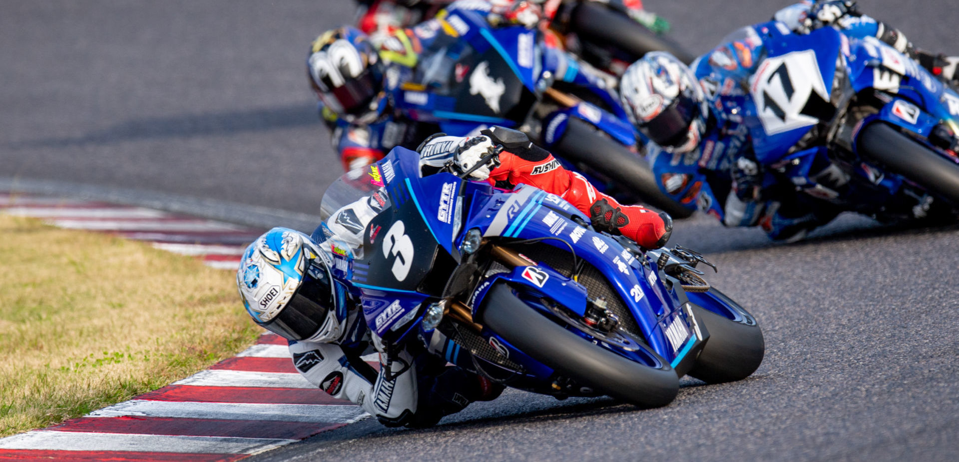 Kohta Nozane (3) leads Ryuichi Kiyonari (17) and Katsuyuki Nakasuga (1) at Suzuka. Photo by Kohei Hirota Photography.