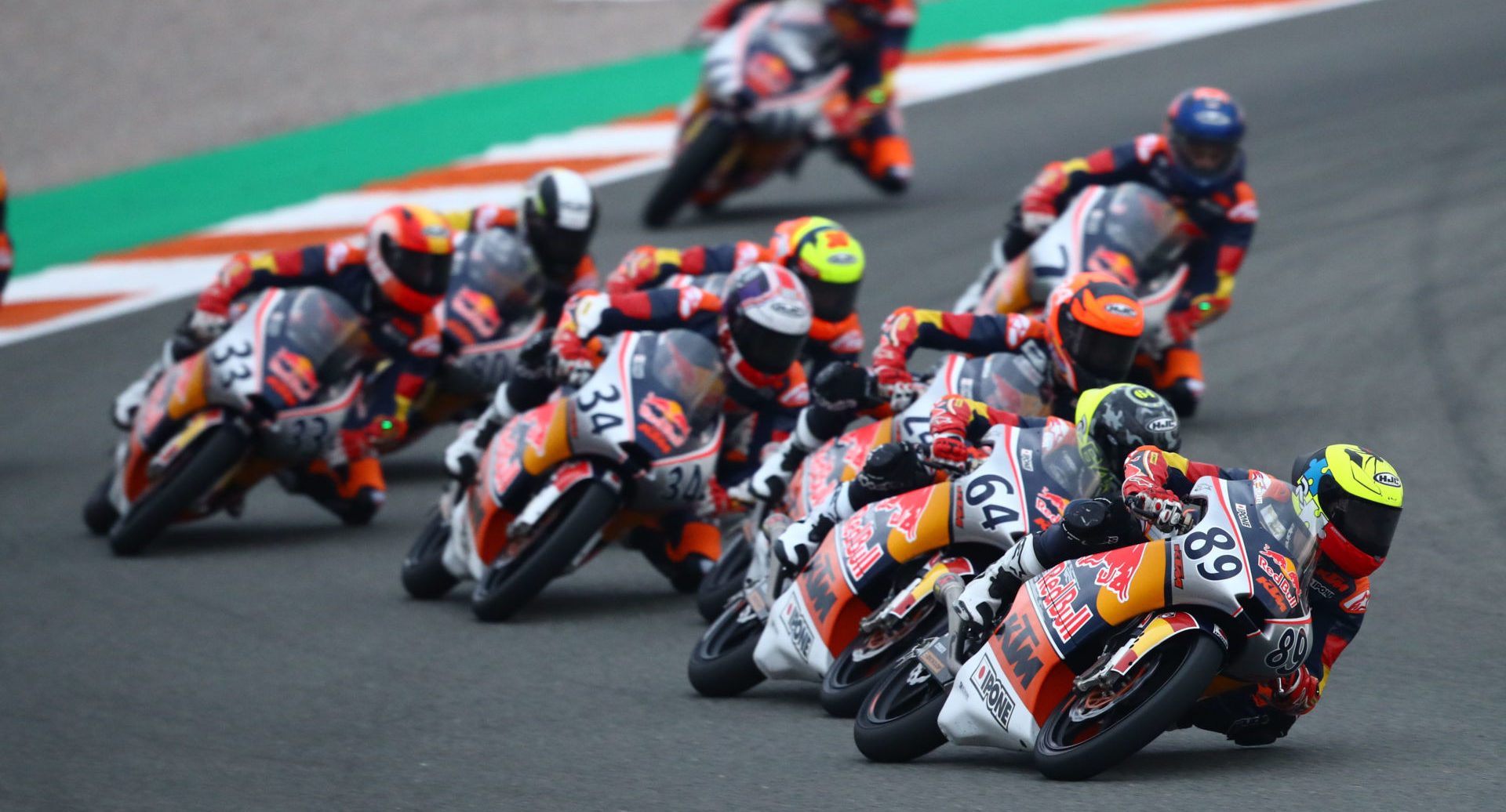 Marcos Uriarte (89) leads a pack of Red Bull MotoGP Rookies during Race One at Valencia II. Photo courtesy Red Bull.