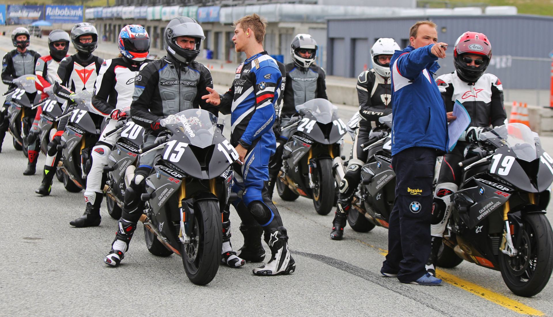 California Superbike School students lined up on pit lane at Laguna Seca. Photo by etechphoto.com, courtesy California Superbike School.