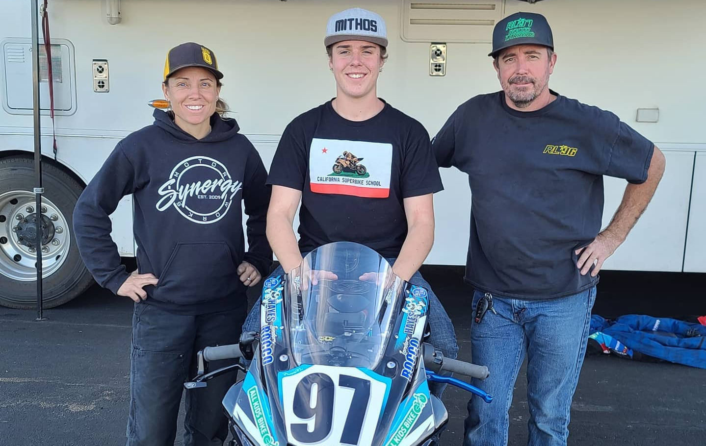 Rocco Landers (center) with his father Stoney Landers (right) and MP13 Racing Team Owner Melissa Paris (left) at Chuckwalla Valley Raceway. Photo courtesy Rocco Landers.