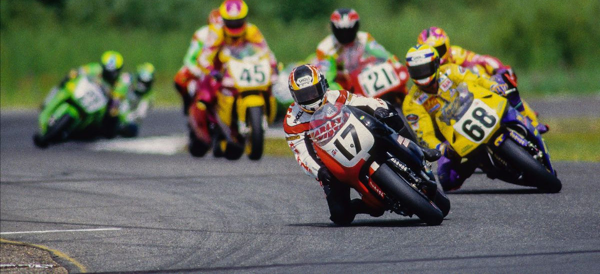 Miguel Duhamel (17) leads Mike Smith (68), Jamie James (hidden). Pascal Picotte (21) and Colin Edwards (45) in the heat of battle at Brainerd International Raceway in 1994. MotoAmerica is bringing Superbike racing back to BIR at the end of July after a 17-year hiatus. Photo by Brian J. Nelson, courtesy MotoAmerica.