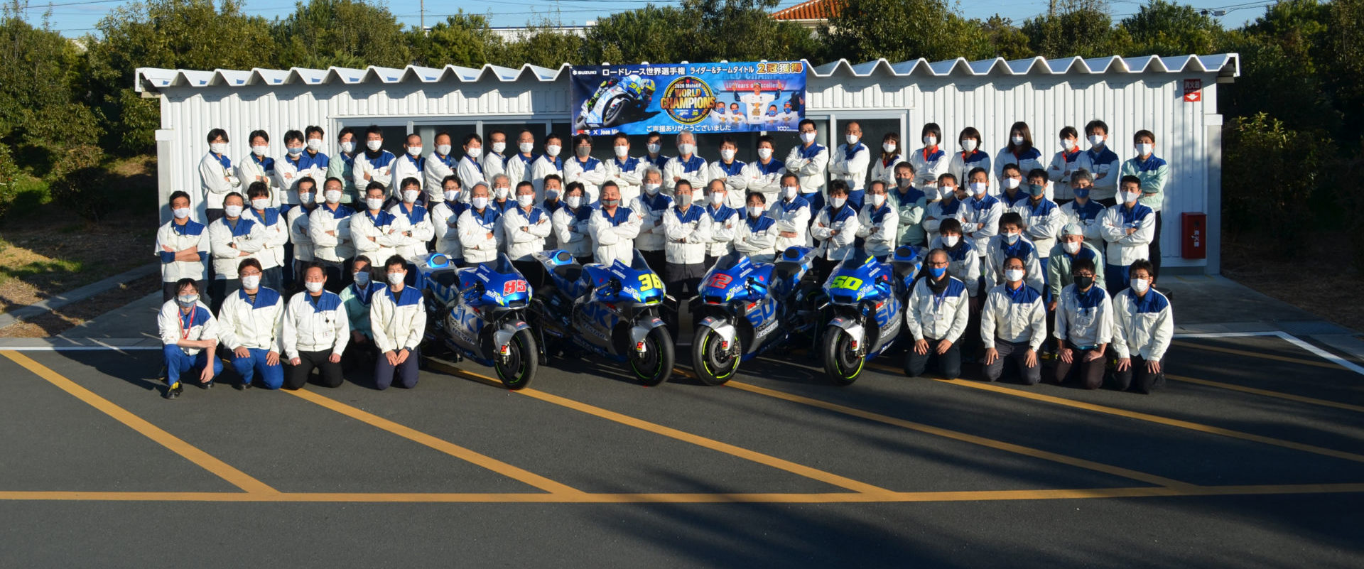 Suzuki Racing staff outside a support building at Suzuki's test track in Japan. Photo courtesy Team Suzuki Press Office.